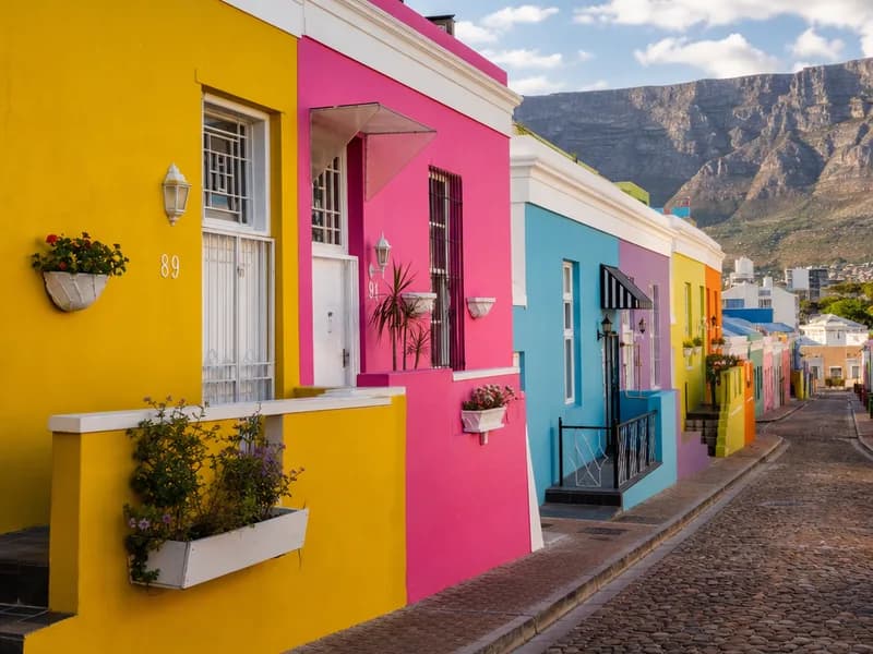 A sunlit row of painted houses in Bo-Kaap, Cape Town